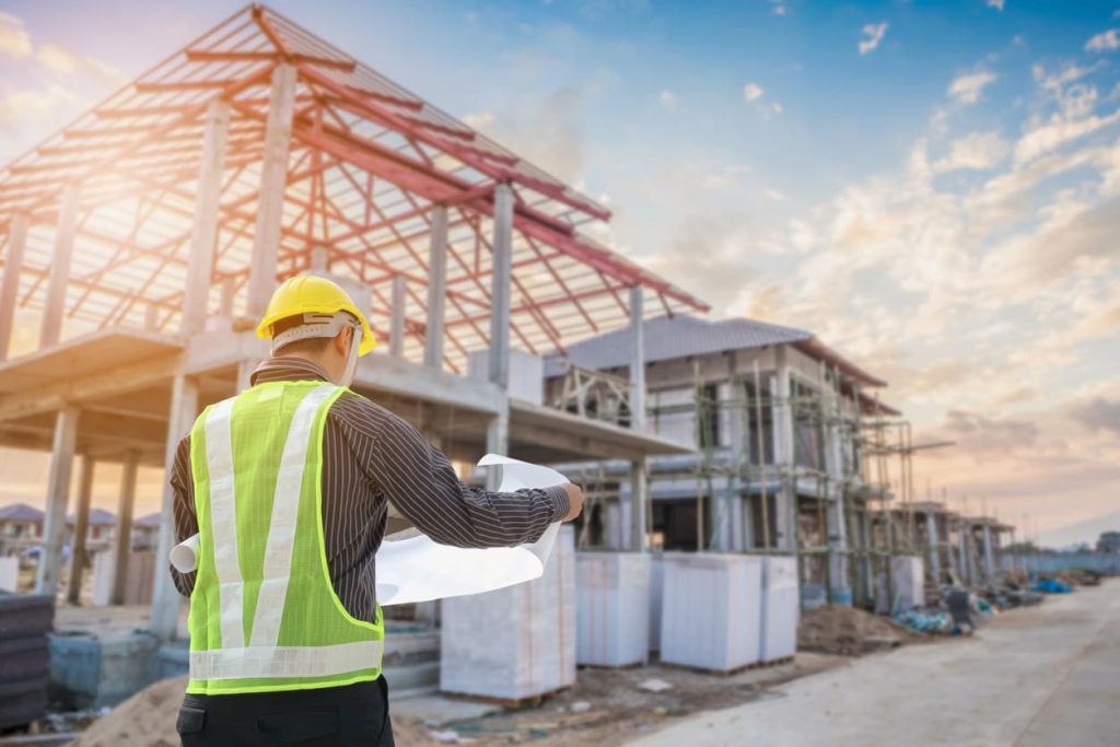 a construction manager overseeing various construction types on the job site