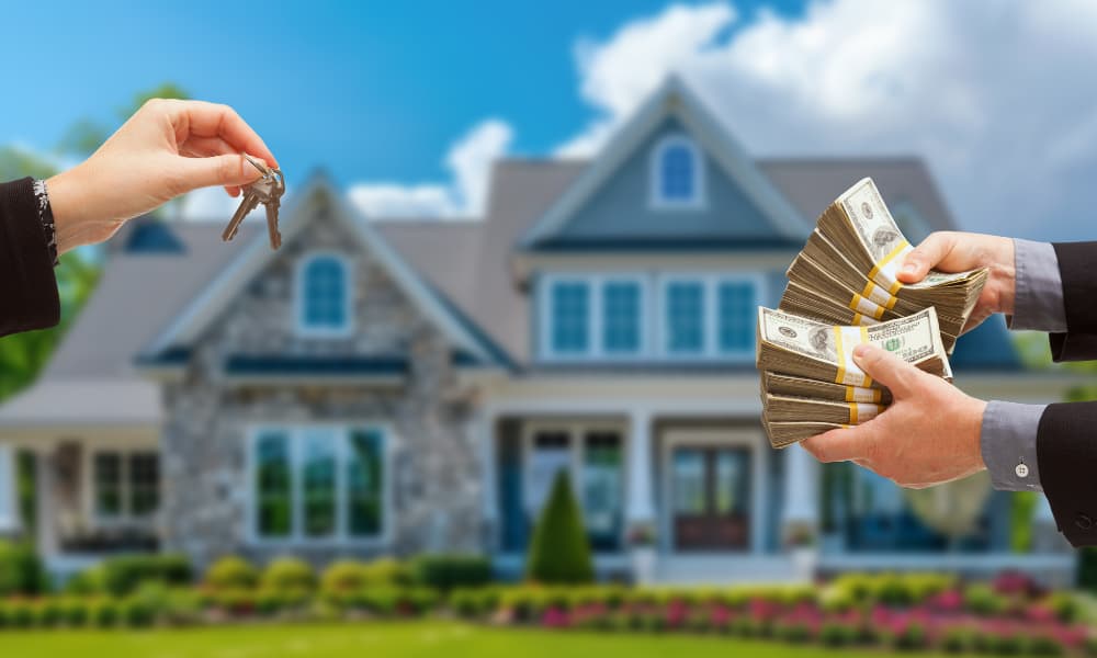 One pair of hands holding house keys to another pair holding money in front of a Florida suburban house.
