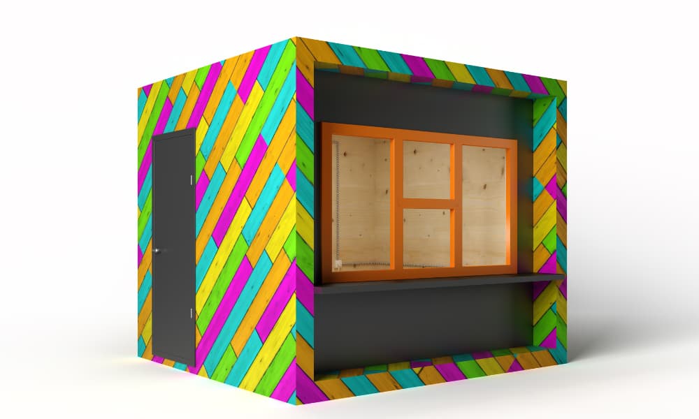 A vibrantly colored square kiosk against a white background. The sides of the kiosk are fitted with diagonally placed planks of wood colored pink, green, yellow, and blue. A dark gray door is set into one side. The kiosk features a serving window with an orange frame surrounded by dark gray panels, and the interior is light wood.