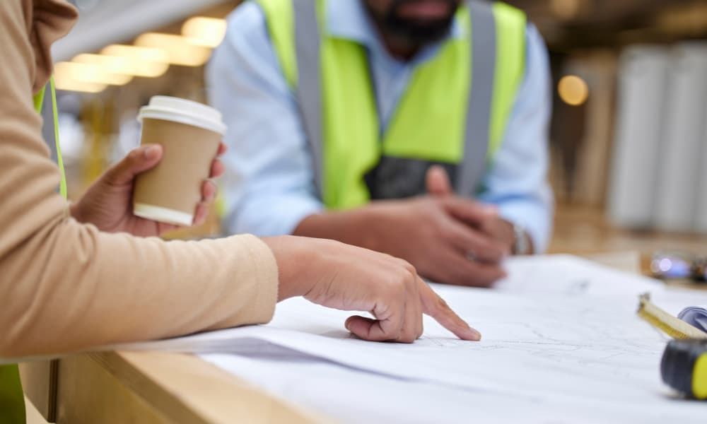 commercial construction project manager going over project plans